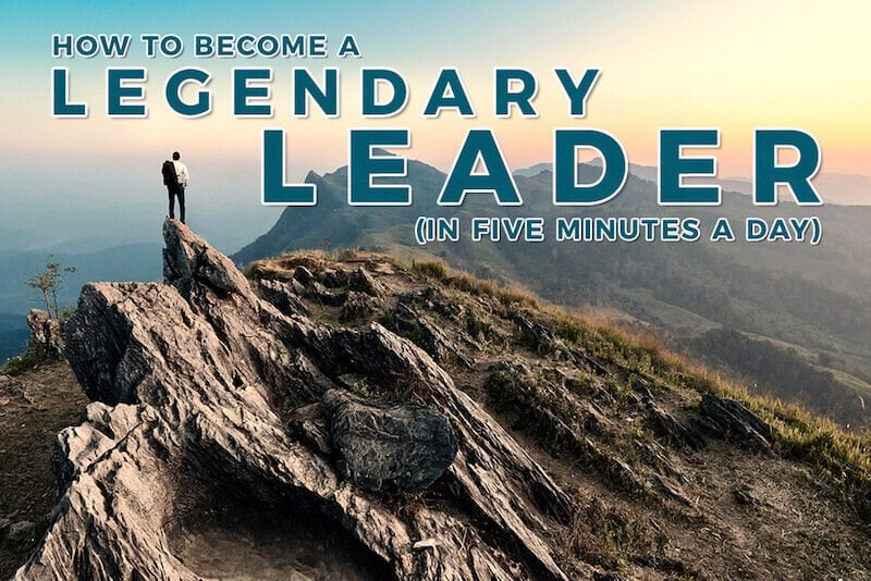 Person standing on top of a mountain after investing in his leadership development and becoming a legendary leader.